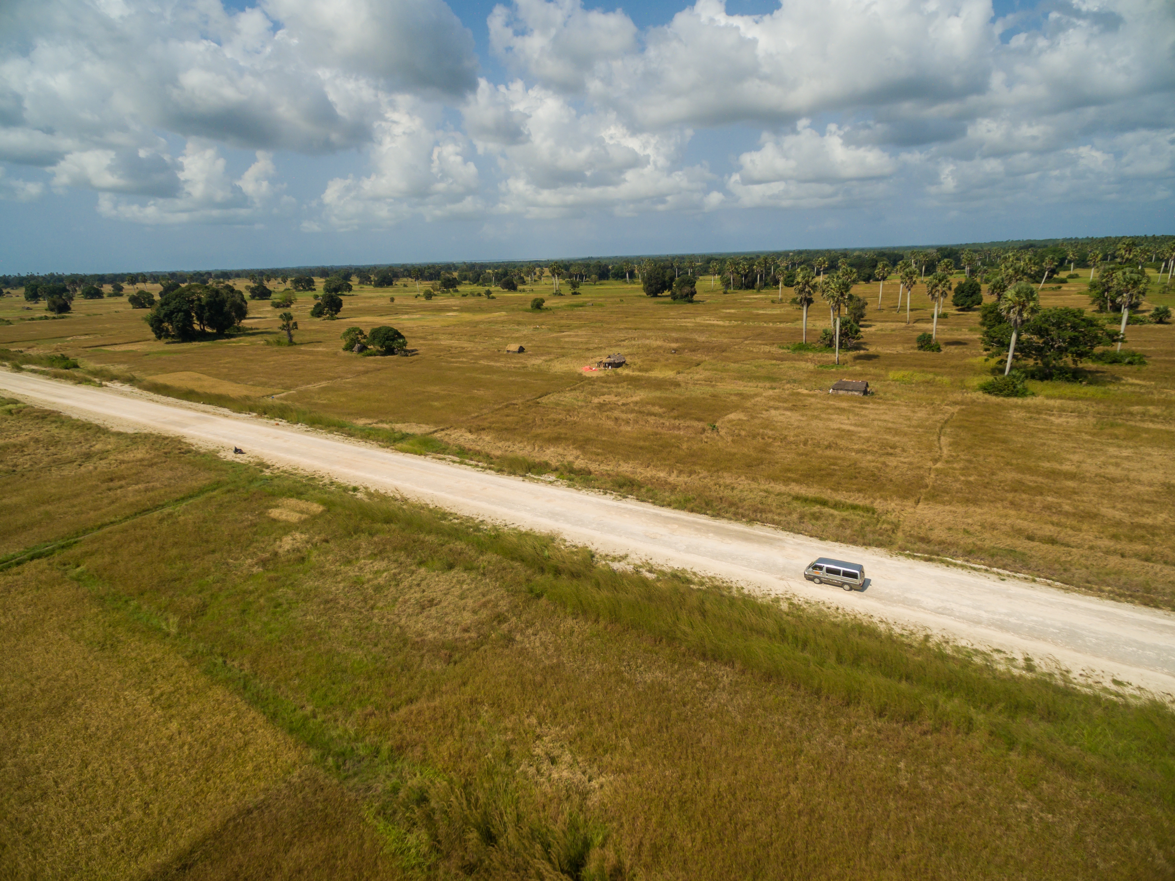 Aerial Shot Road Surrounded By Grass Covered Fields Captured